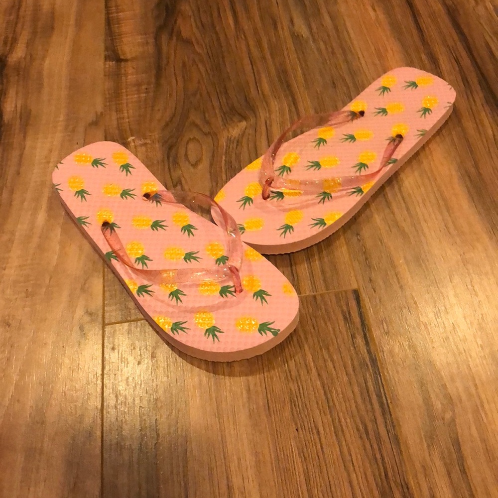 Never worn pink, pineapple flip flops